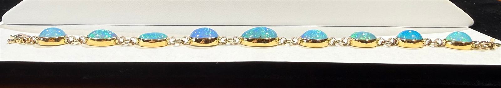 Nine-stone Welo opal link bracelet in 14k and 22k gold